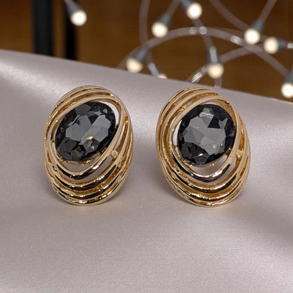 Large Gold-Toned Stud Earring.