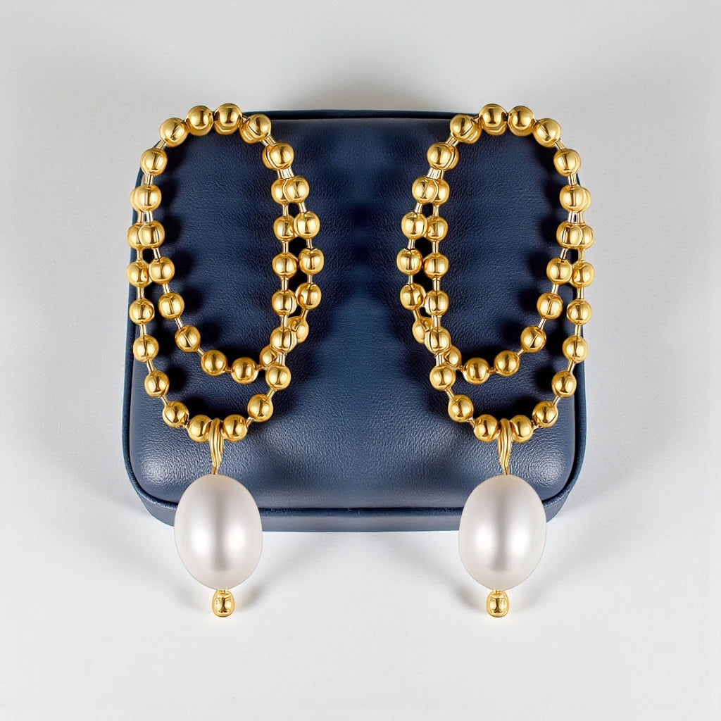 18 K Gold-toned beaded double-concentric hoop design with teardrop-shaped white pearl Waterproof Stainless Steel Earrings