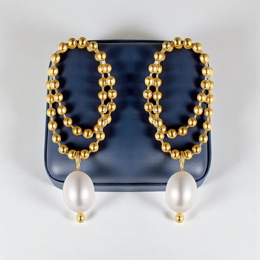 18 K Gold-toned beaded double-concentric hoop design with teardrop-shaped white pearl Waterproof Stainless Steel Earrings